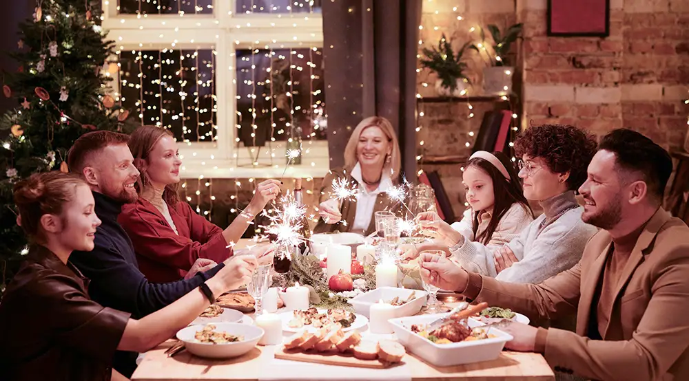 A family gathers around the table for a delicious feast on Christmas Eve.