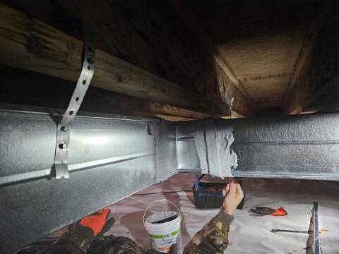Here our duct crew is sealing the connections to ensure proper air flow and efficiency!