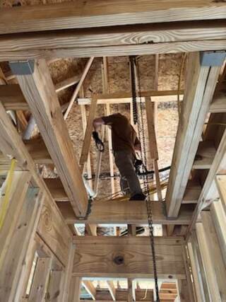 Seth is walking the beams, getting ready to hand over tools!