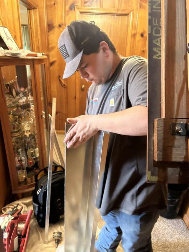 Caleb is preparing the sheet metal to go up!