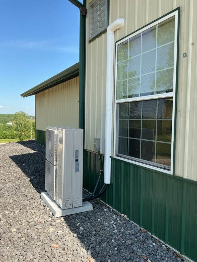 Side view of the outdoor unit showing the electrical connections.