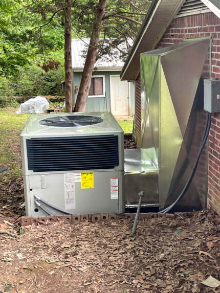 Another view showing the new unit and duct work.